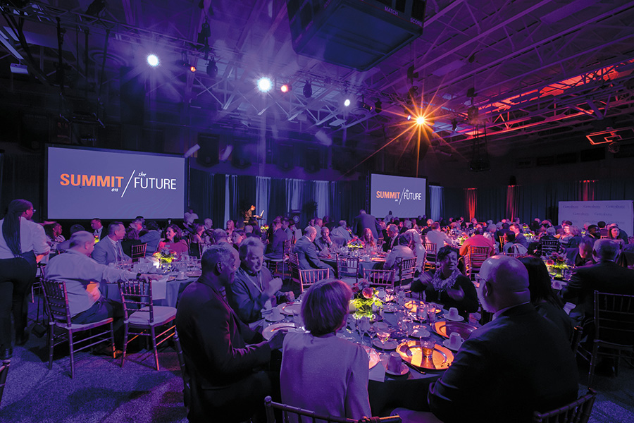 Alumni, faculty, and staff gathered inside a transformed Bream Gym