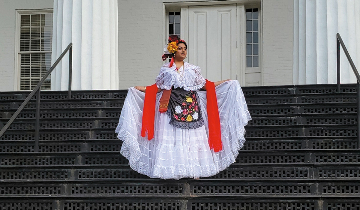 Ivana Lopez Espinosa ’19 stands on the steps of Penn Hall