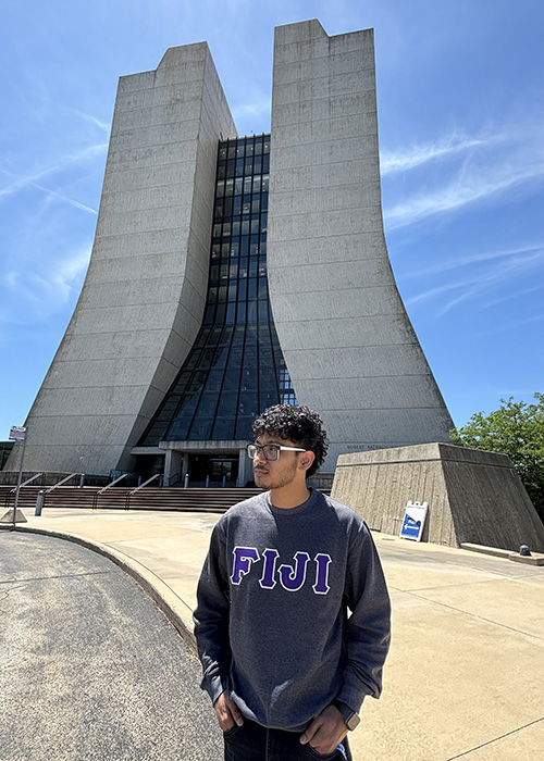 Yaman Acharya takes a photo outside Wilson Hall