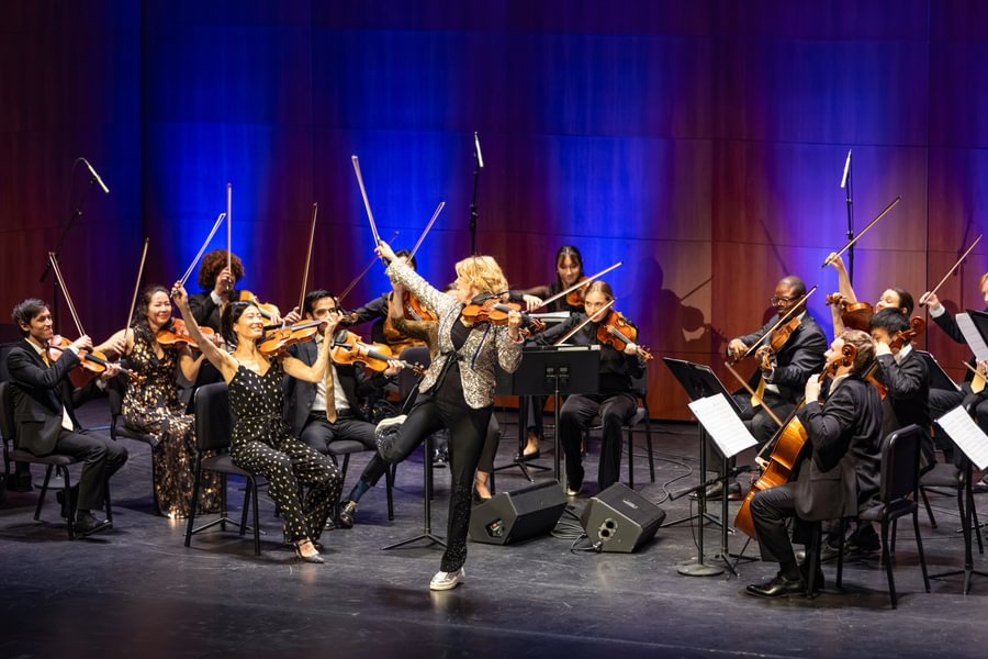 Natalie MacMaster and Orpheus Chamber Orchestra perform together on the Majestic stage during the Centennial Celebration. 