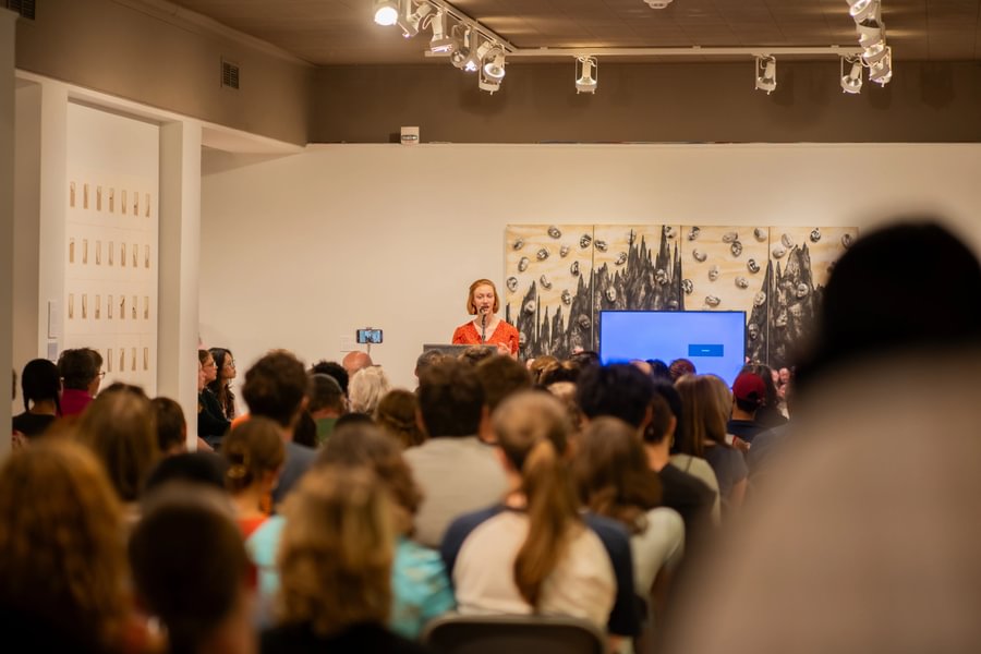 Ava Prickman ’28 curates an exhibit on Chinese Cultural Revolution propaganda posters.