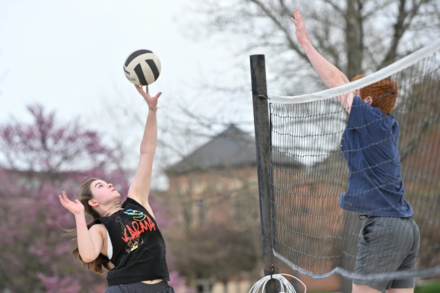 Students play intramural beach volleyball during the fall.