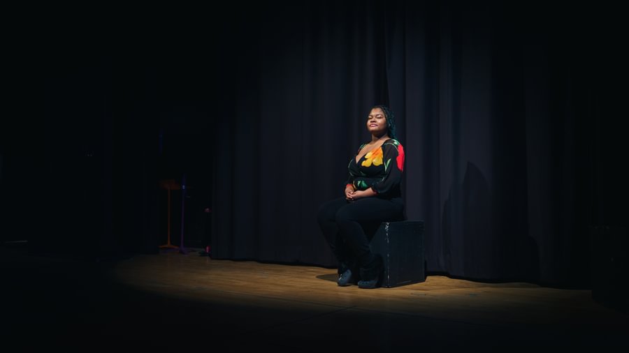 Britney Brunache ’22 is seen on stage at Gettysburg College’s Stevens Theatre.