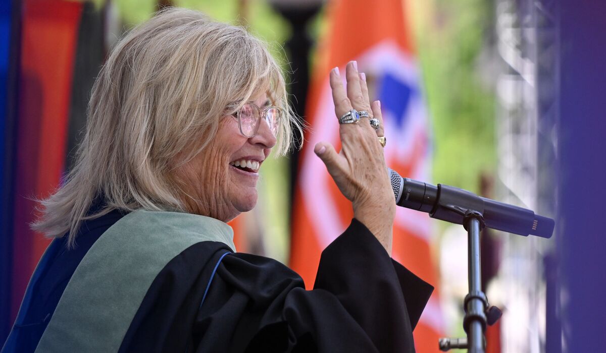 Keynote speaker Carol Daly Cantele ’83, P’15 displays her four championship rings.