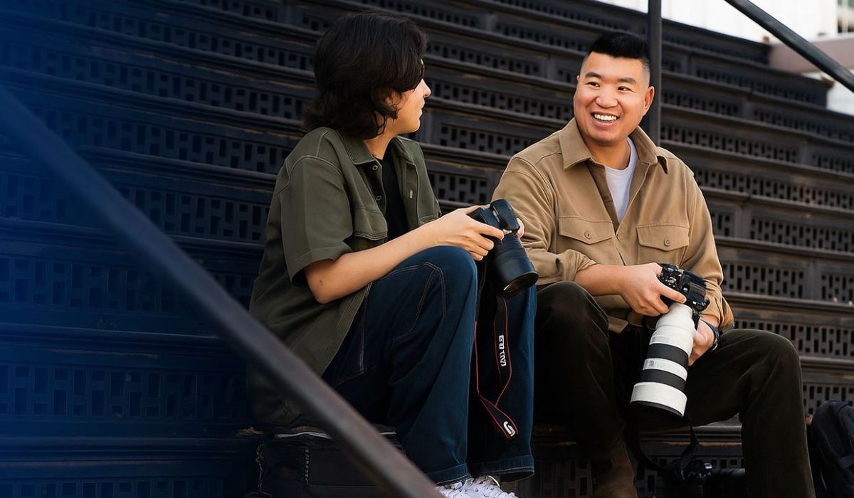 Eric Lee Talking on the stairs talking with a photographer 