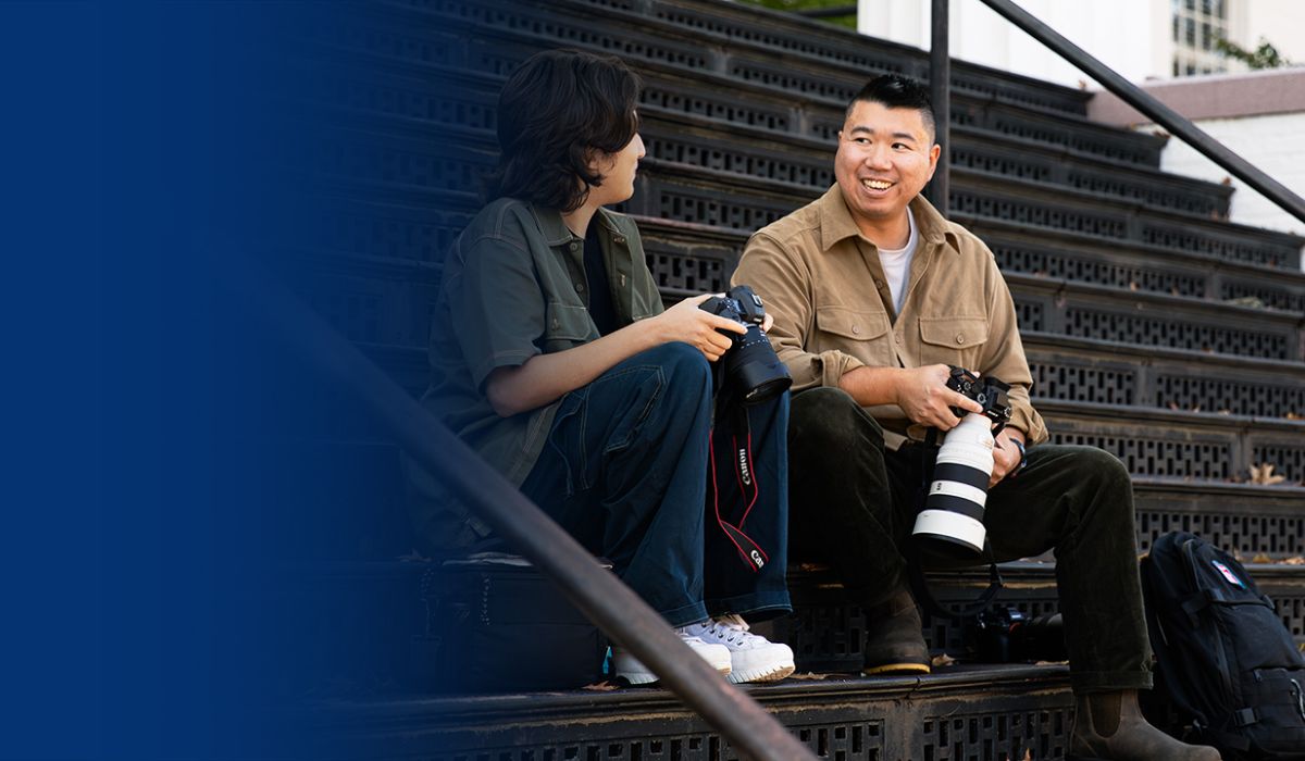 Eric Lee Talking on the stairs talking with a photographer 