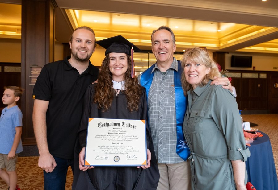 Brook Rajnowski M’25 with family after Commencement.