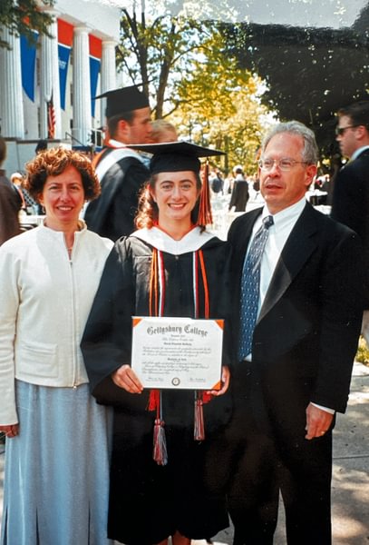 Garcia (center) with her parents at her graduation from Gettysburg in 2002.