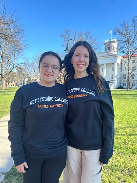 Two students wearing crewnecks earned through the Career Development Pathway.