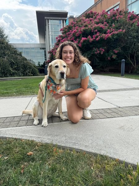 Jocelyn Little ’25 with Summit, a former service dog she trained.