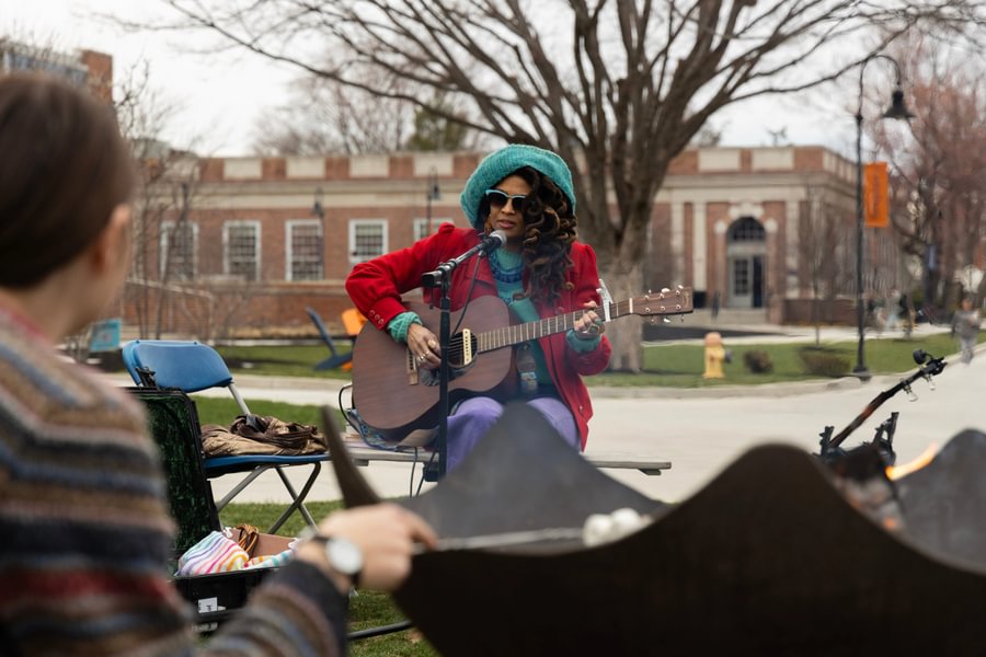 Valerie June plays music with students on Stine Lake.