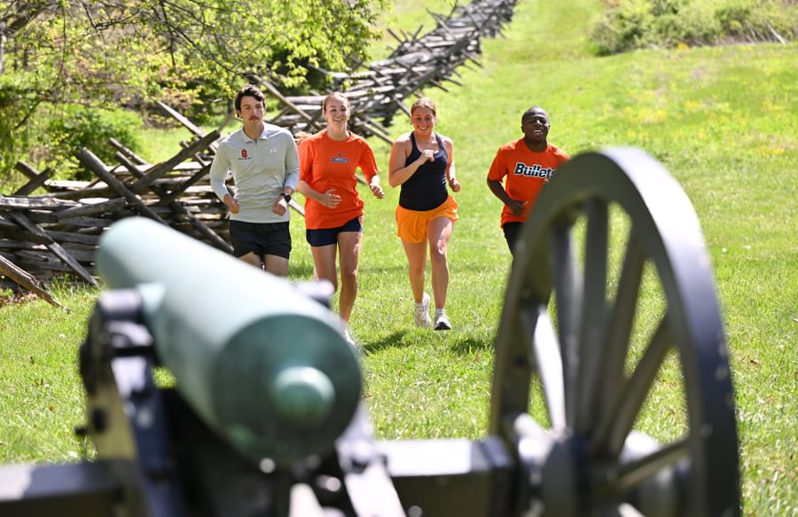 Students enjoy a run through Gettysburg National Military Park.