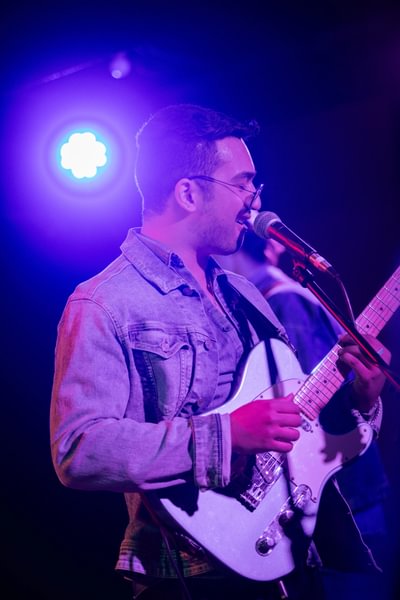 Pradhan performs on stage during a Listeners & Performer’s event.