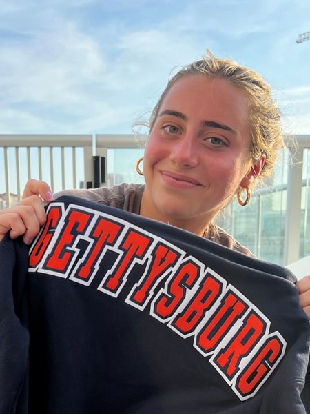 Sadie Mauro holds a Gettysburg sweatshirt after being invited to join the women’s lacrosse team.