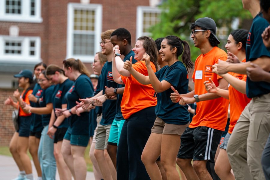 Bishruti Rijal &rsquo;26 (second from center) joins fellow student staff members from Residence Life to greet first-year students on Move-In Day.