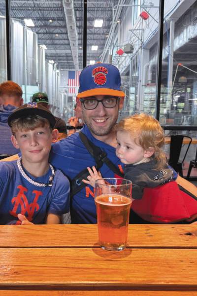 An image of Brin Freund ’06 with his children