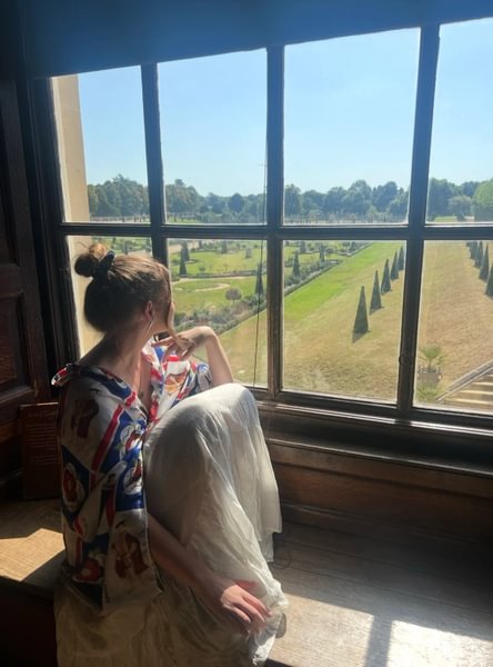 Colleen Bergmann &rsquo;25 looking out a window at Hampton Court Palace