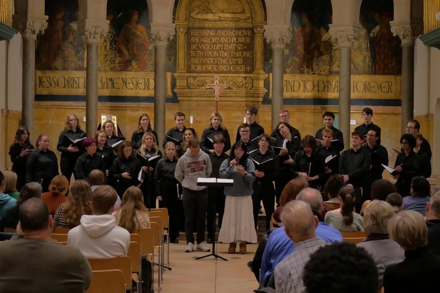 Choir honors alumnus James Lamb ’21 with opening tour performance dedication.