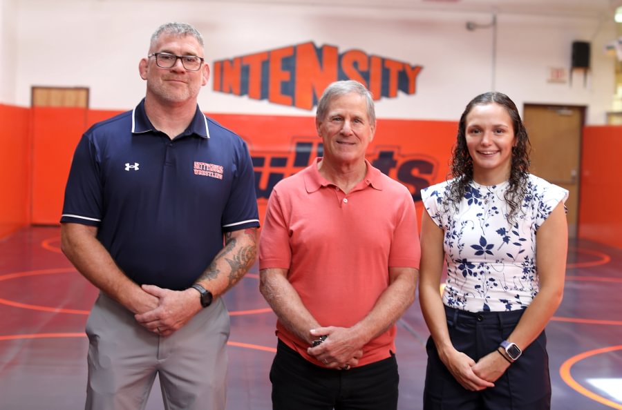 Bob Ortenzio ’79 (center) with Head Women’s Wrestling Coach Chris Haines and Assistant Coach Montana DeLawder.