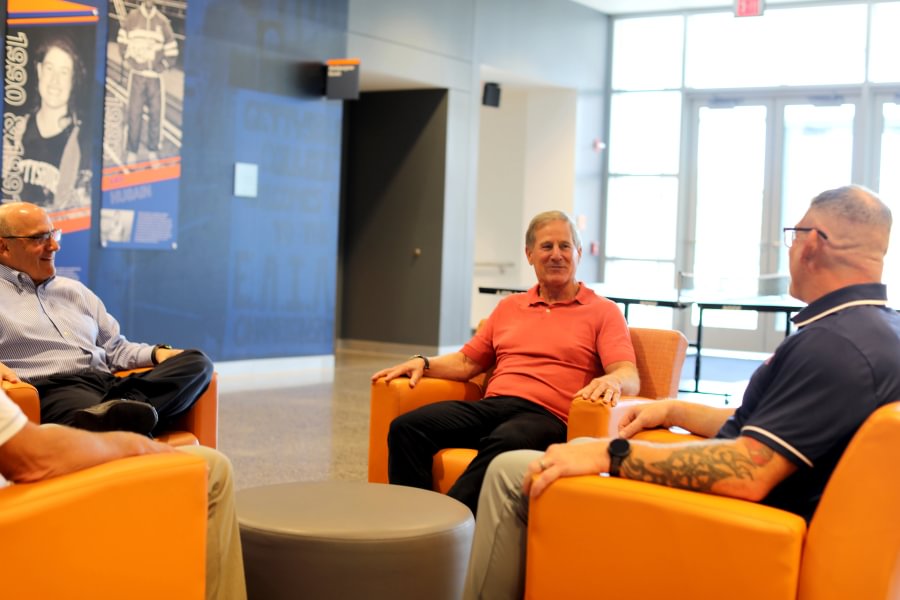 Bob Ortenzio &rsquo;79 meets with College President Bob Iuliano and the coaching staff from both wrestling programs inside the Jaeger Athletic Center..