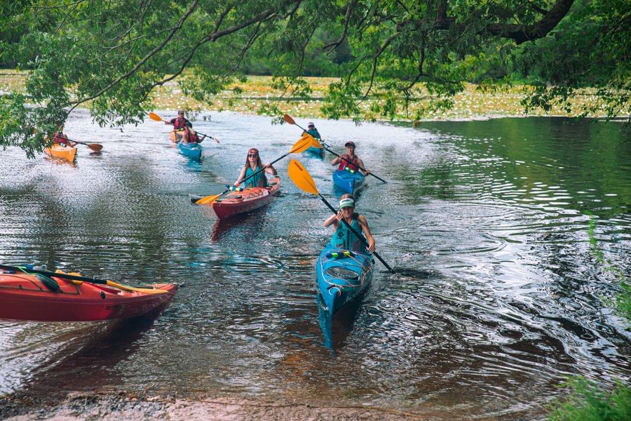 Students kayaking together during an outdoor activity.