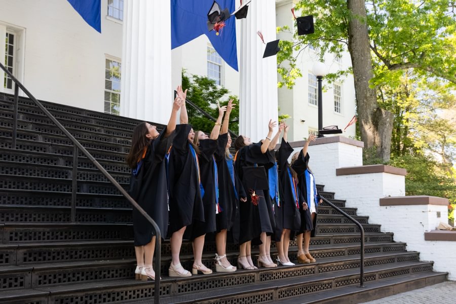 Gettysburg&rsquo;s newest graduates toss their caps in the air on the steps of Pennsylvania Hall.