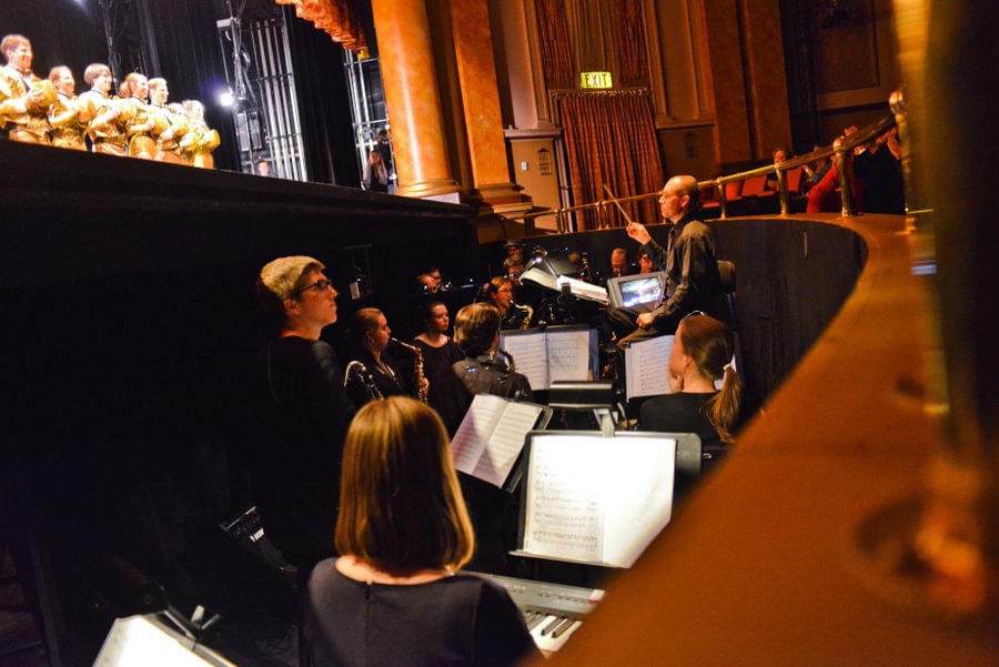 Music Prof. John &ldquo;Buzz&rdquo; Jones conducts the band during a showing of &ldquo;A Chorus Line&rdquo; at the Majestic Theater in 2013.