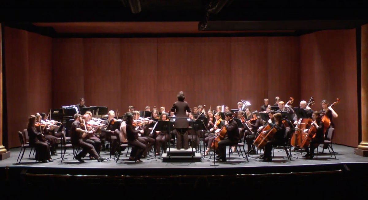 Ana Vashakmadze '22 conducts an orchestra on campus