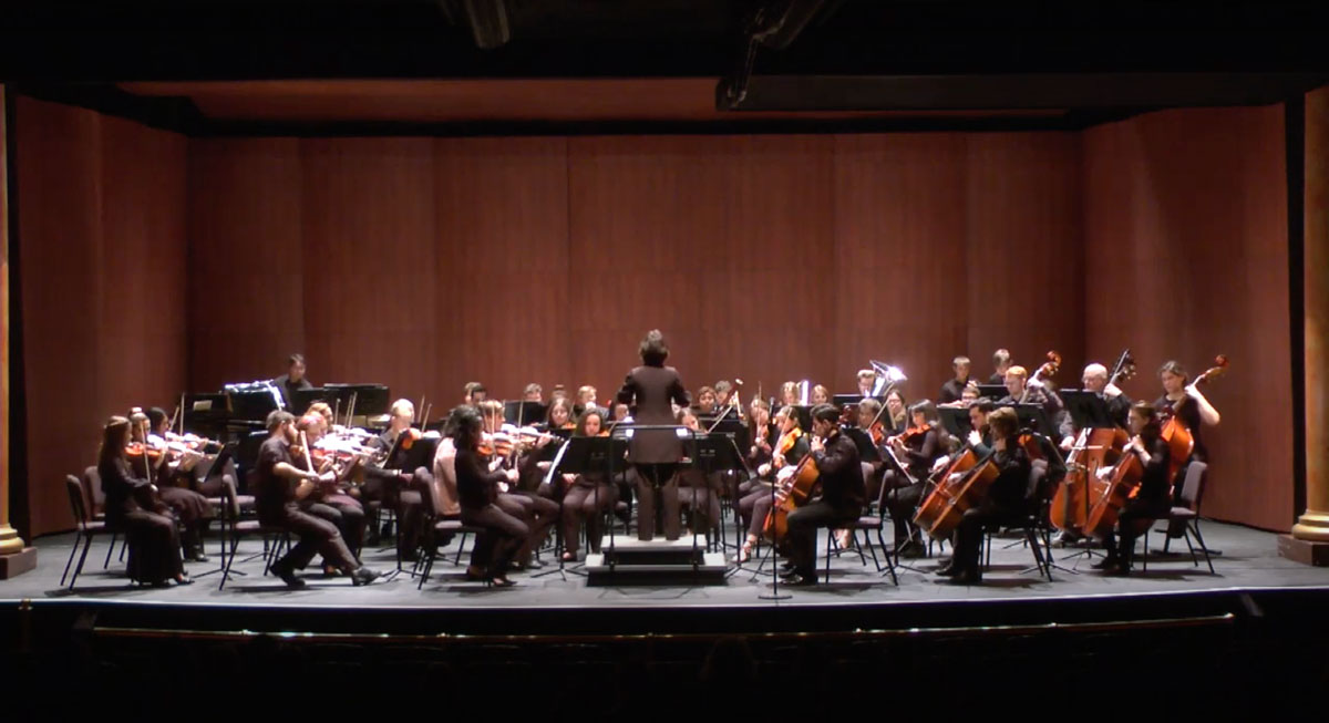 Ana Vashakmadze '22 conducts an orchestra on campus