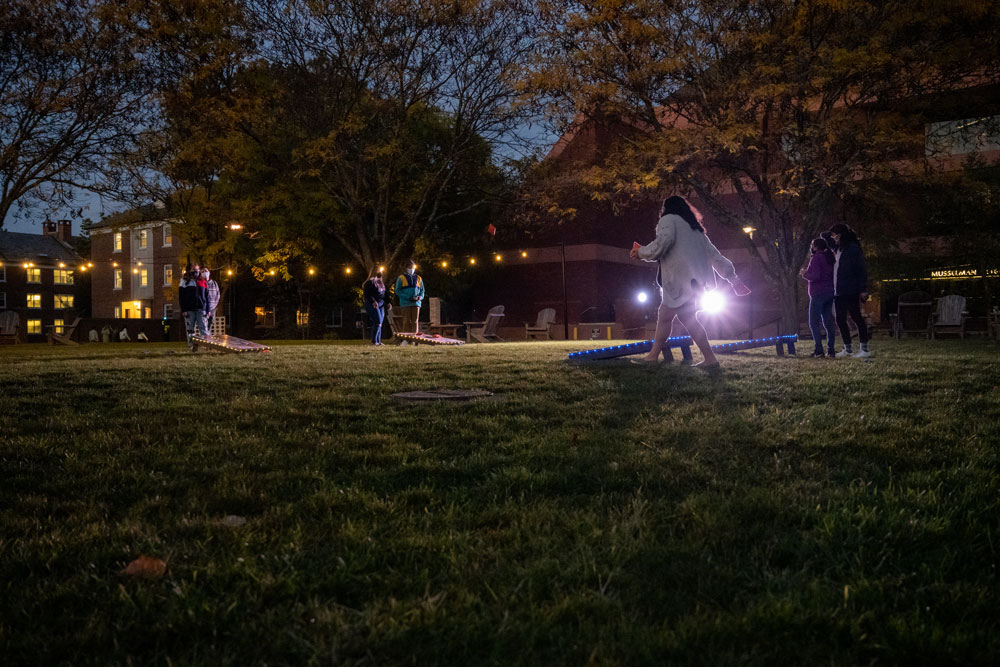 Students playing bean bag toss on Gettysburg College's campus