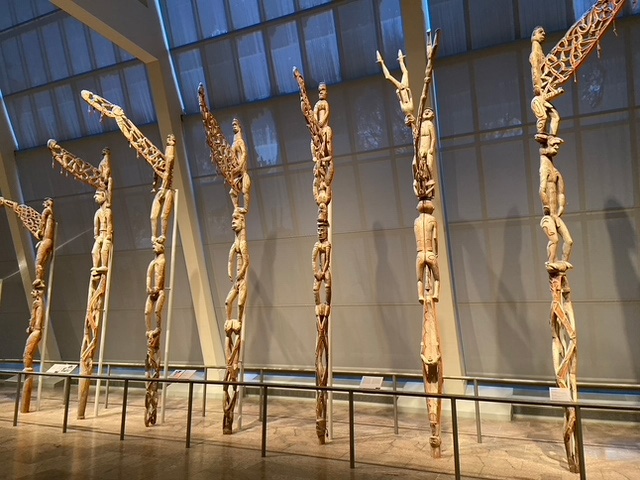 Photo of wooden poles with carvings inside them at the Metropolitan Museum