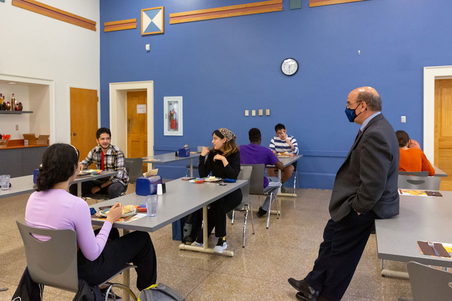 President Bob Iuliano speaking to students in the cafeteria