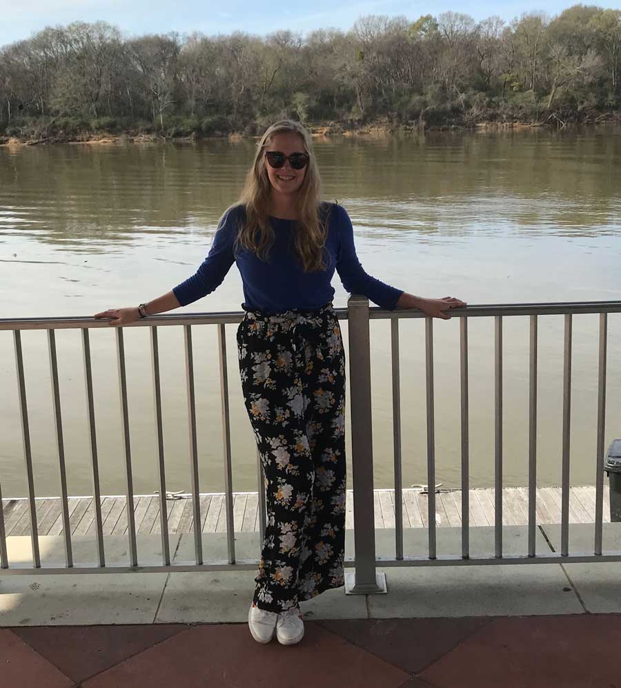 Cailin Casey standing outside near a river