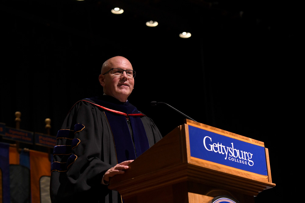 Provost Chris Zappe standing at a podium