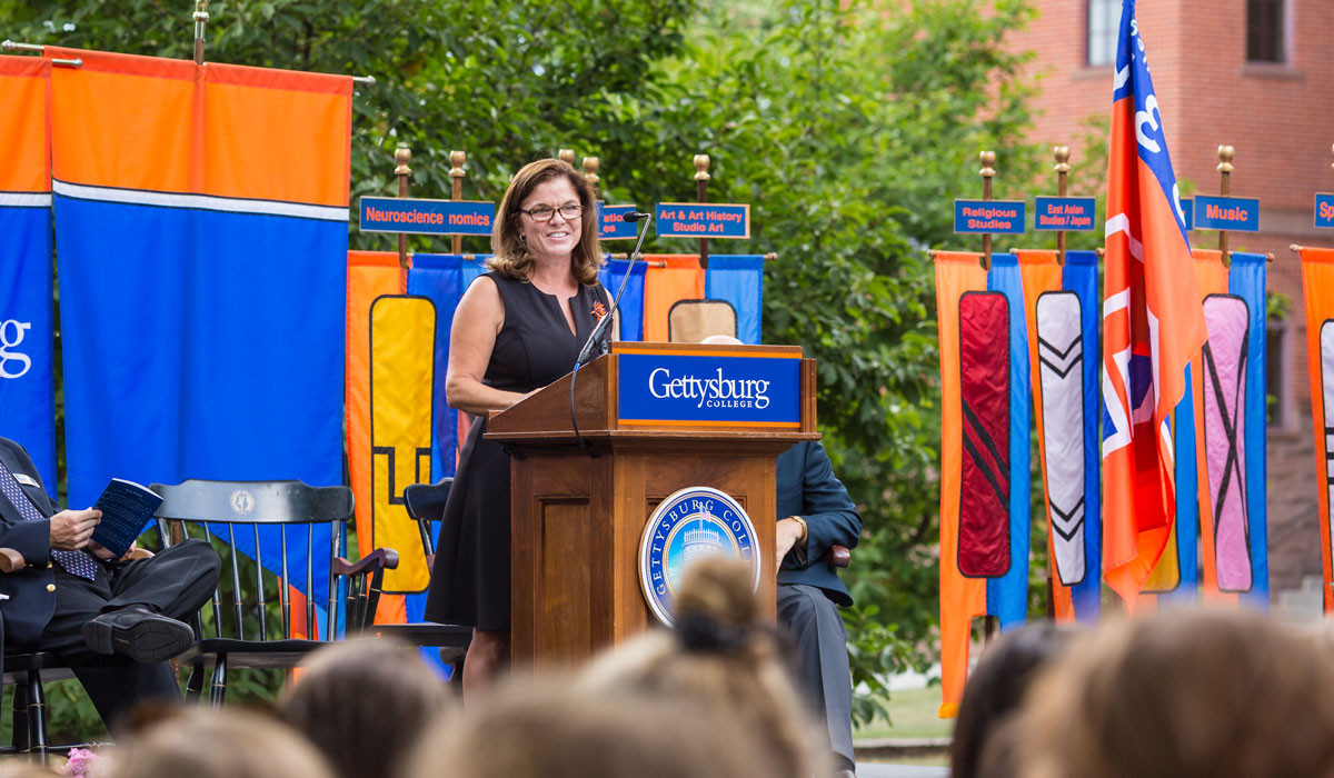 Professor Anne Douds speaking from a podium