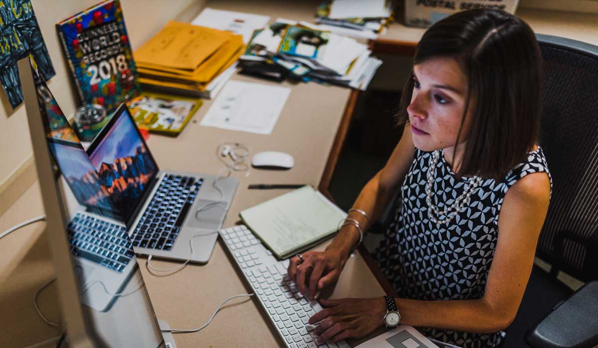 Elizabeth Hilfrank sitting at a desk in front of a computer