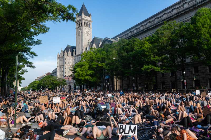 Demonstrators lie on the ground to protest police brutality