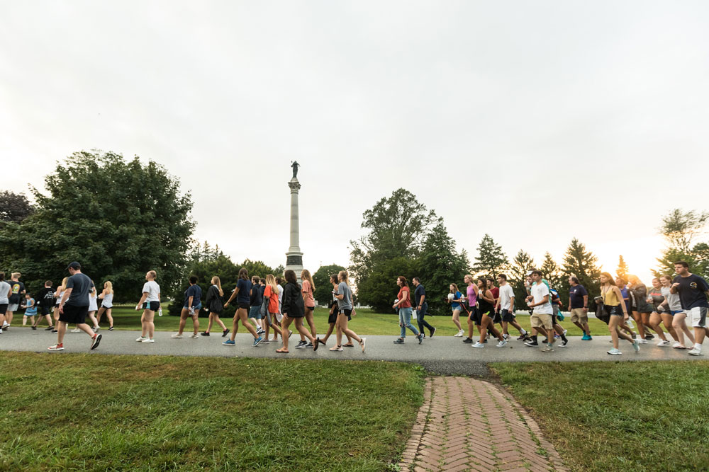 The class of 2023 walking into Soldier National Cemetery