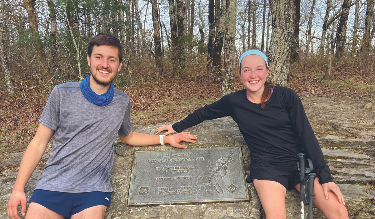 Garst and Ruben sitting on a rock along the Appalachian Trail