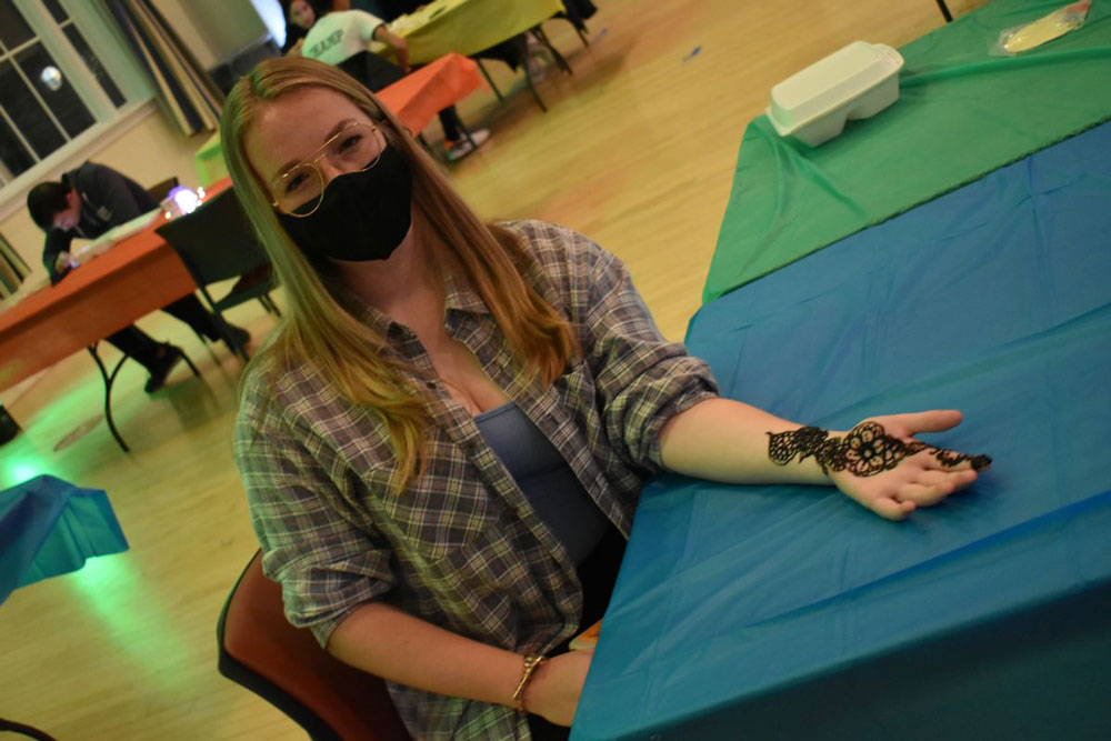 Student with henna art design on her hand