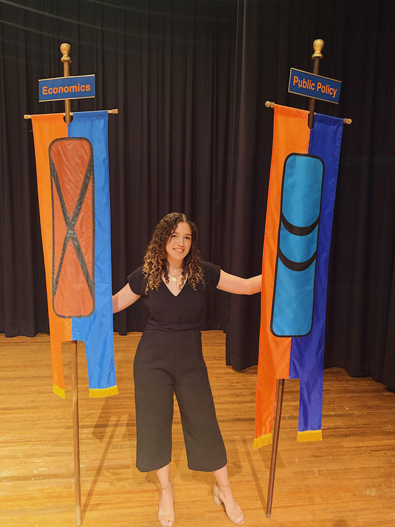 Jeniffer Flores holding department flags