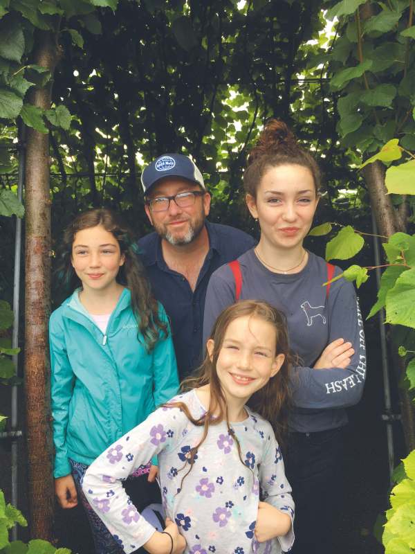 Photogrpah of Kauffman with his daughters