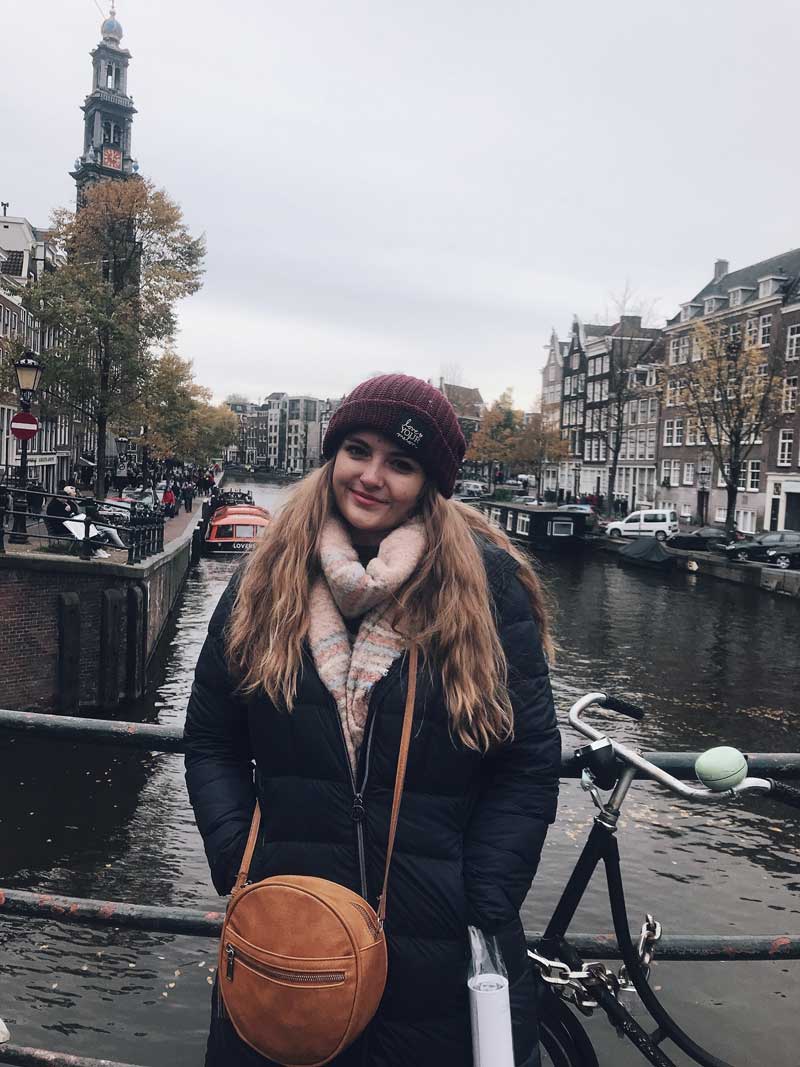 Madison Miller standing in from of a canal in Amsterdam