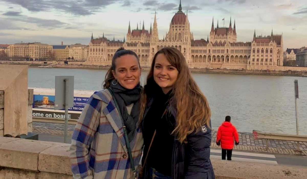 Madison Miller standing in front of the Parliament of Budapest