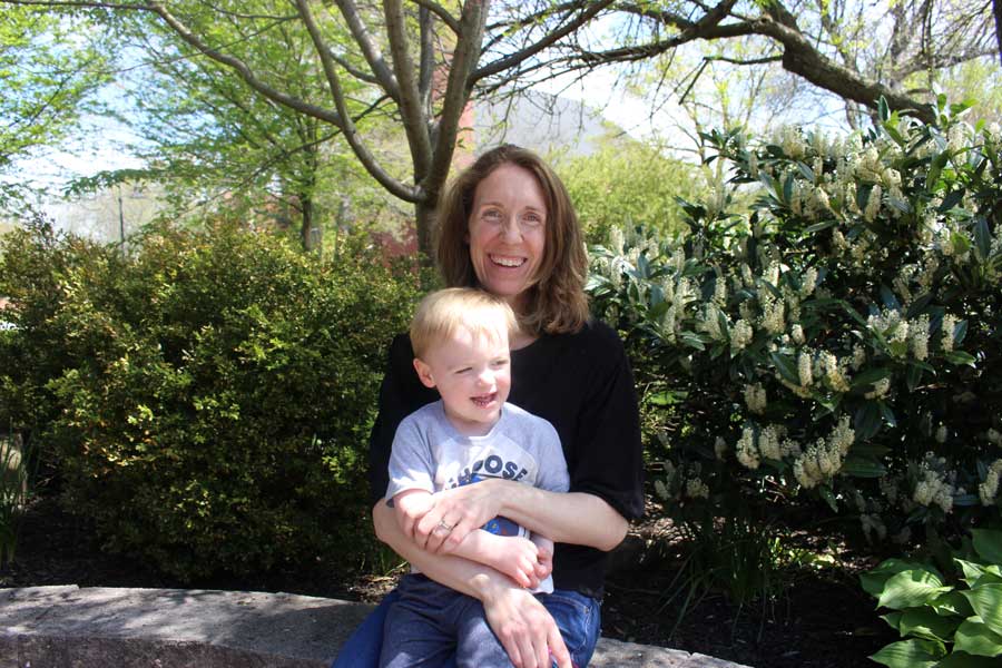 Kimberly McMenamin sitting with her son