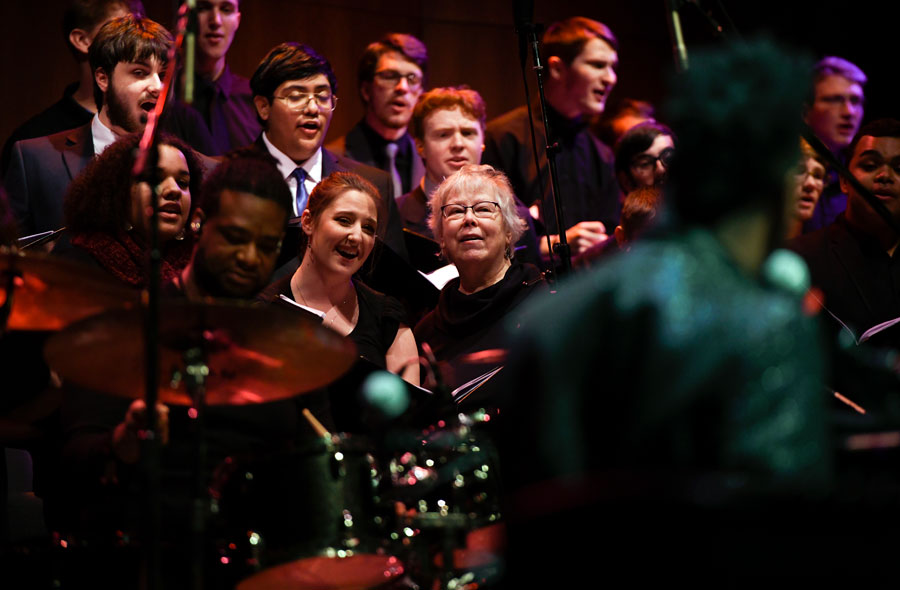 Members of Gettysburg's College and Concert choirs sing with Damien Sneed and his band