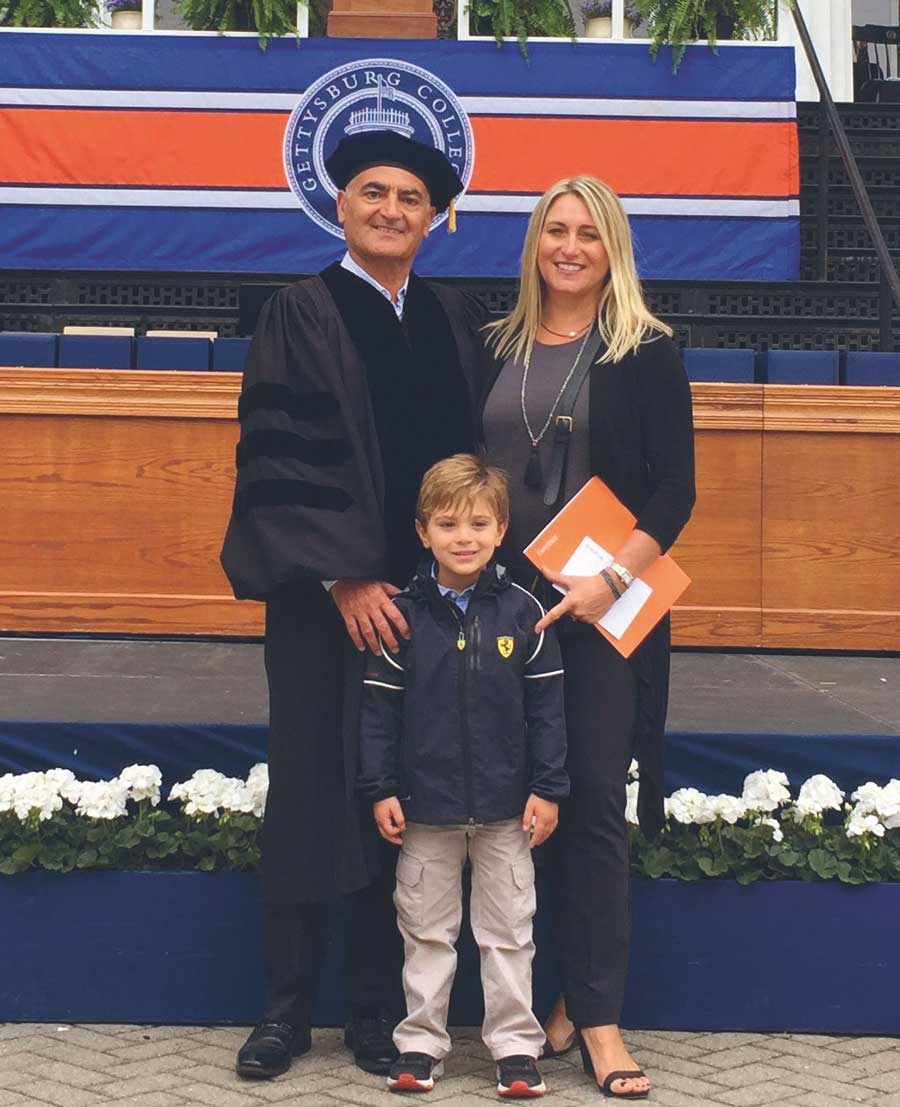 Moncef Slaoui posing with his wife Kristen and his son Ryan