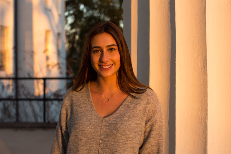 Paige Evans standing in front of Penn Hall