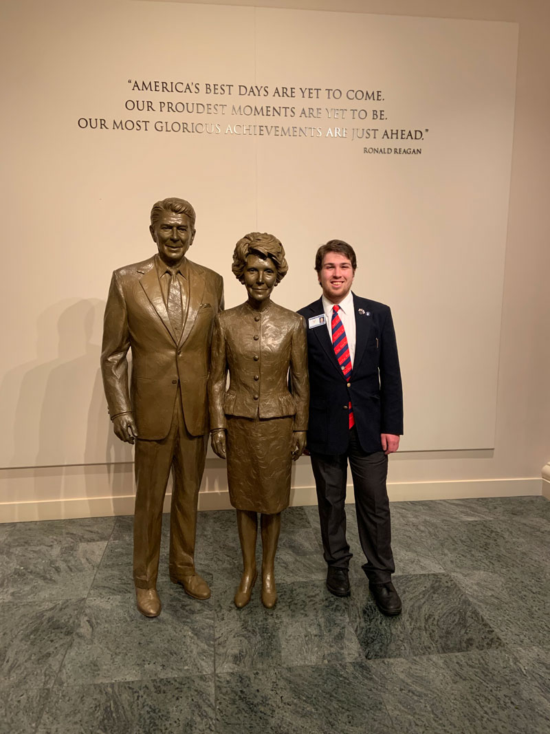 Ziv Carmi with a statue of Ronald Reagan at the Ronald Reagan Presidential Library