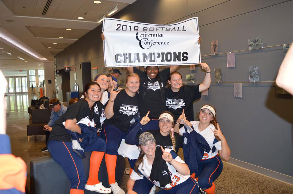 Taylor and Madison with the Bullets softball team inside of the Jaeger Center